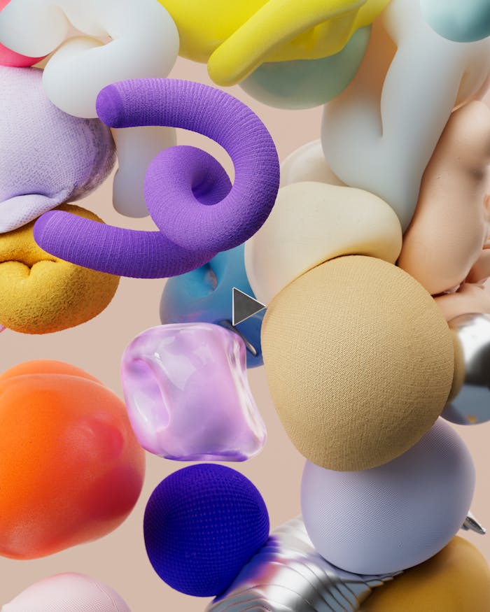 home-hero Vibrant 3D composition of abstract shapes in an array of colors, showcasing digital artistry.